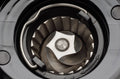 Conical burr set inside a coffee grinder grinding chamber, viewed from above
