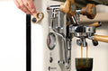 LELIT Mara X3 pulling espresso while a hand adjusts the Pagaia flow profiling paddle