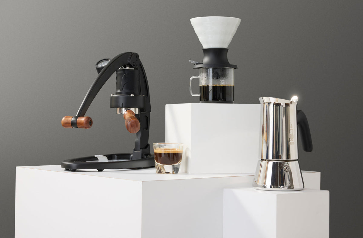 Flair 49 Pro manual espresso maker, Hario Switch pour-over dripper, and Bialetti Venus moka pot