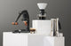 Flair 49 Pro manual espresso maker, Hario Switch pour-over dripper, and Bialetti Venus moka pot